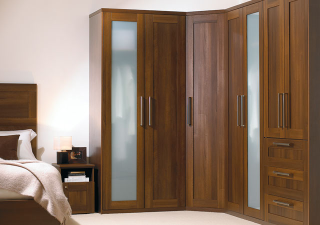 A wooden wardrobe in a bedroom